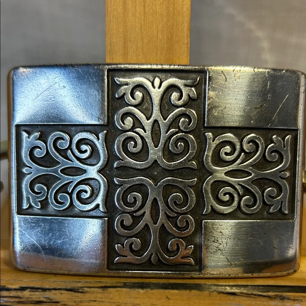 Celtic cross/decorative silver colored belt buckle made